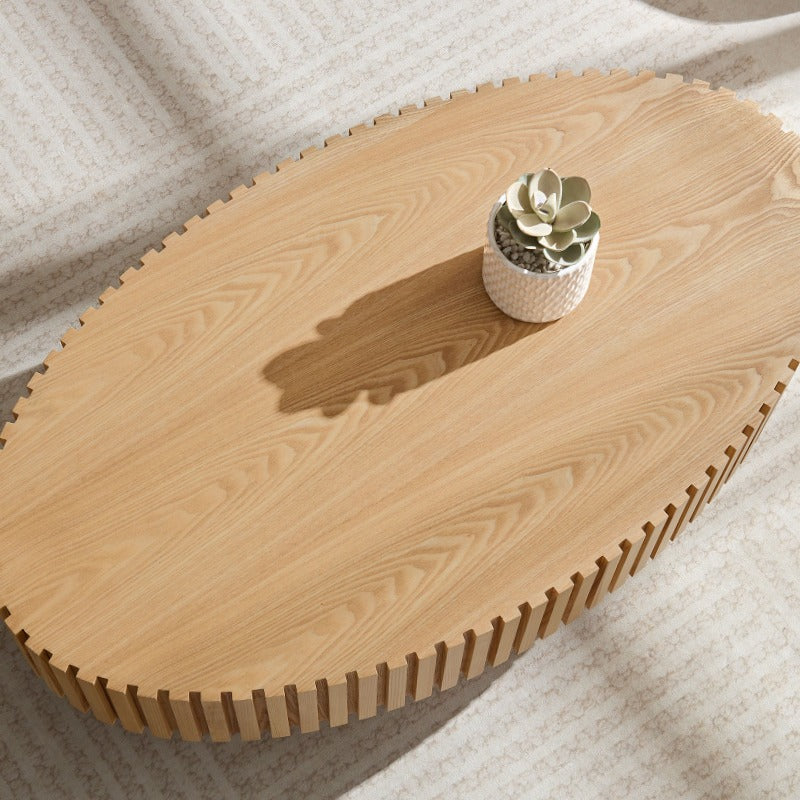 Contemporary Handcrafted Drum-Shaped Coffee Table, Measuring 43.7 Inches in Length, Designed in an Oval Shape for The Living Room. This Compact Coffee Table Boasts a Robust Pedestal Base And Is Made from Natural Ash, Perfect for Modern Home Decor.